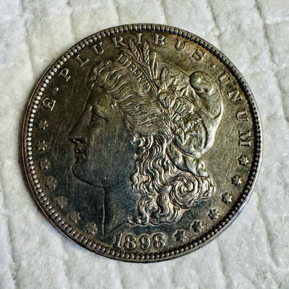 1898 Morgan silver dollar, no mint mark.